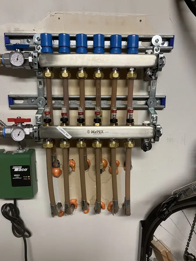 Plumber performing Water Heater Repair at a residential property in Stratham